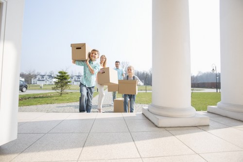 Student moving day with labelled boxes and household items in Ealing