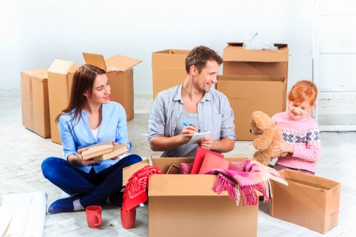 Packed boxes and furniture prepared for a home removal service in Ealing