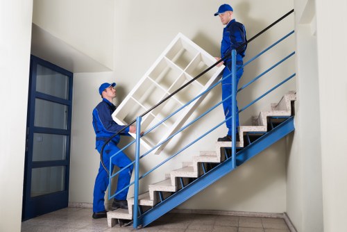Local office movers handling equipment in West London