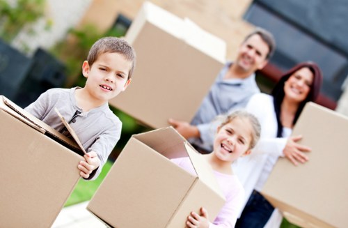 Removal team loading household items for a move in Ealing