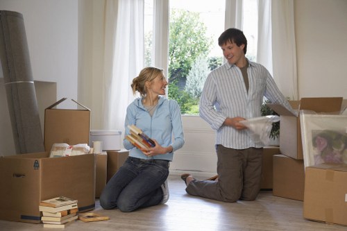 Loading furniture into a van on a residential street in Ealing