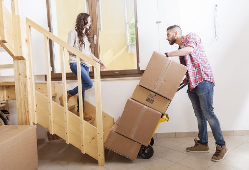 Staff handling furniture carefully during a removal job