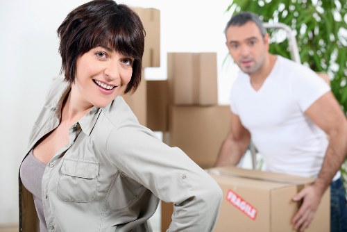 Careful loading of household items into a removals van