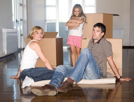 Trained movers using safe lifting techniques and PPE
